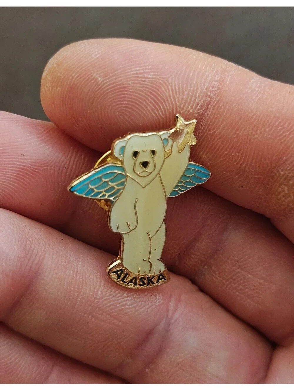 1980s Alaskan Polar Bear Guardian Angel Gold Tone Enamel Pin.